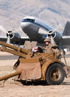 Warhorses guarding the airfield, as Dakota takes off