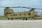The CH-47F, serial #16-08201, begins to taxi. On both side an air crew member check everything is clear for taxiing