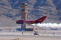 Great shot of the Red Bull MiG-17 with the Nellis AFB tower in the background