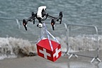 DJI Inspire drone carrying a first aid box