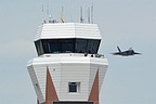 F-22 Raptor appearing from behind Westover's tower