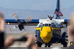 Fat Albert crew member waiving the flag