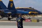 Blue Angels ground crew saluting the pilots as they taxi out