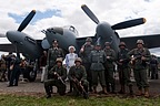 Re-enactors of the Axis side posing in front of the Mosquito