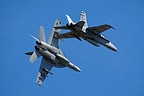 F/A-18E breaking away from a F/A-18C