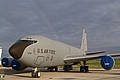 Half of a rainbow arcs behind Boeing KC-135R, 58-008, of the New Hampshire National Guard in the static line.