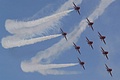 Flying in perfect conditions all nine display aircraft of the Red Arrows pull round in formation during the first part of their show  ...