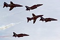 ... and then separate into smaller groups for the second and more dynamic part of their display as here where two aircraft of a five-ship pull up and out of formation.