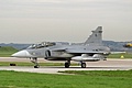 AMRAAM carrying Saab JAS-39C Gripen, 9820, from the 211th. Tactical Squadron of the Czech Air Force arrives for the static display.