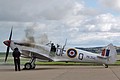 A cloud of black smoke on engine start for Spitfire LF.IX, MK356 UF-Q, of the Battle of Britain Memorial Flight in late-war 6 Squadron markings.