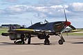 Post-flight checks on Battle of Britain Memorial Flight Hurricane IIC, PZ865/JX-E, in the 1 Squadron Night Reaper' markings of Karel Kuttelwascher.