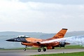 A touch and go while streaming smoke during the display by the Royal Netherlands Air Force Solo Display F-16AM