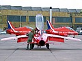Red Arrows past and present as G-TIMMS/XP504 now marked as XS111 is pre-flighted with the Hawks of the current team beyond