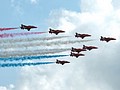  With smoke on the Red Arrows begin their display but with only eight rather than the usual nine aircraft 