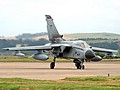617 Squadron Tornado GR.4 ZA404/013 in standard markings and carrying a Litening Laser Designator Pod arrives for the airshow