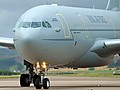 The waving crewman gives an idea of scale as the 101 Squadron Airbus Voyager KC.3 taxies past