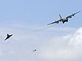 Austrian Air Force Air Policing Demo with one Eurofighter EF2000 alongside and the other in trail as the ex-RAF C-130K is escorted to land