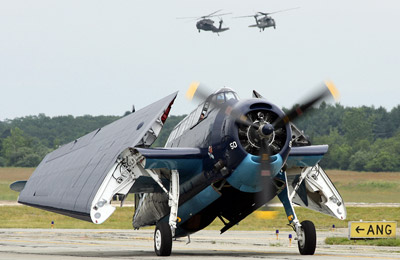 TBM Avenger with the BlackHawks in the background