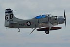 A-1E Skyraider retracting its landing gear, note the deployed air brake