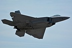 The fifth generation F-22 stealth fighter overhead while it closes the last doors