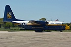 Representing the Marines, the Blue Angels C-130 'Fat Albert' waiving the flag