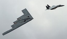 USAF B-2A Spirit escorted by F-15C Eagle