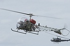 B47G Sioux flying in formation with the UH-1H Iroquois