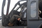 The pilot performing pre-flight checks