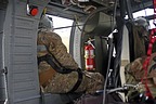 Gunner and flight engineer look out the windows, because they always check everything is clear around the heli in the take off and landing phases