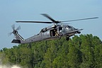 HH-60G approaching to the stony and sandy dry bed of the river, after concluding simulation of personnel recovery