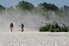 Flight engineer and gunner walking towards us to board again safely