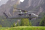 Approach to the narrow grassy strip. Flight engineer and gunner assist pilots in identifying any kind of obstacle during approach operation