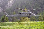 HH-60G Pave Hawk hovering over the narrow grassy strip