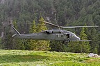 HH-60G Pave Hawk hovering over the narrow grassy strip