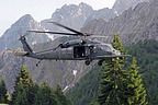 The 56th RQS HH-60G approaching to landing point, in the background the Alpine mountains