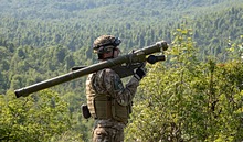 A soldier with the Slovenian Light Air Defense Artillery, scans the horizon for aircraft with a SA-24 Grinch during a simulated battle drill as part of Astral Knight 19 near Postojna, Slovenia, June 4, 2019. <br>(U.S. Army photo by Spc. Ethan Valetski)