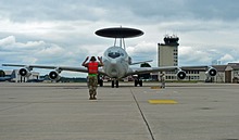 An Airman assigned to the 605th Test and Evaluation Squadron / 505th Command and Control Wing marshals an E-3 Airborne Warning and Control System (AWACS) aircraft at "Rams"tein Air Base, Germany, June 6, 2019. The 605th TES made "Rams"tein home for a week to provide support during Exercise Astral Knight. <br>(U.S. Air Force photo by Staff Sgt. Jimmie D. Pike)