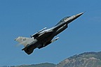 A F-16CM of the 555th Fighter Squadron "Triple Nickel" climbing after a simulated missed approach for runway 05. 