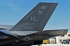 Close-up of the F-35 15-5200 tail with 421 FS "Black Widows" markings, ACC emblem, and Hill AFB tailcode. 