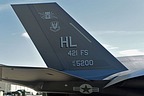 Close-up of the F-35 15-5200 tail with 421 FS "Black Widows" markings, ACC emblem, and Hill AFB tailcode. 