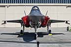 Front view of the F-35A Lightning II with canted Sidewinder rails on the outer wing stations. 