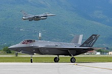 An Italian Air Force F-35A Lightning II assigned to the 3° Gruppo / 32° Stormo, Amendola Air Base, taxis while a 555th FS / 31st FW F-16 Fighting Falcon takes off during Astral Knight 2021 at Aviano Air Base, Italy, May 21, 2021. <br>(U.S. Air Force photo by Airman 1st Class Brooke Moeder)