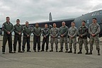 B-52 Flight crew (aircraft commander, pilot, radar navigator, navigator and electronic warfare officer) and ground crew pose in front of the aircraft.