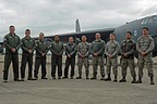 B-52 Flight crew (aircraft commander, pilot, radar navigator, navigator and electronic warfare officer) and ground crew pose in front of the aircraft.