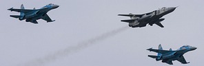 Resident Su-24M 41 White bomber in formation with the deployed Su-27/Su-27UB fighters