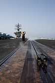 View of the catapult's shuttle to which the gear towbar is attached