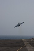 Super Hornet climbing away