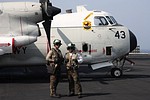 Squadron plane inspectors in front of C-2A Greyhound