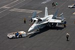 VFA-131 'Wildcats' F/A-18C Hornet moved by the blue shirts