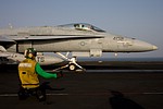 The hookup man giving the thumb up for the VFA-131 'Wildcats' F/A-18C Hornet to be catapulted